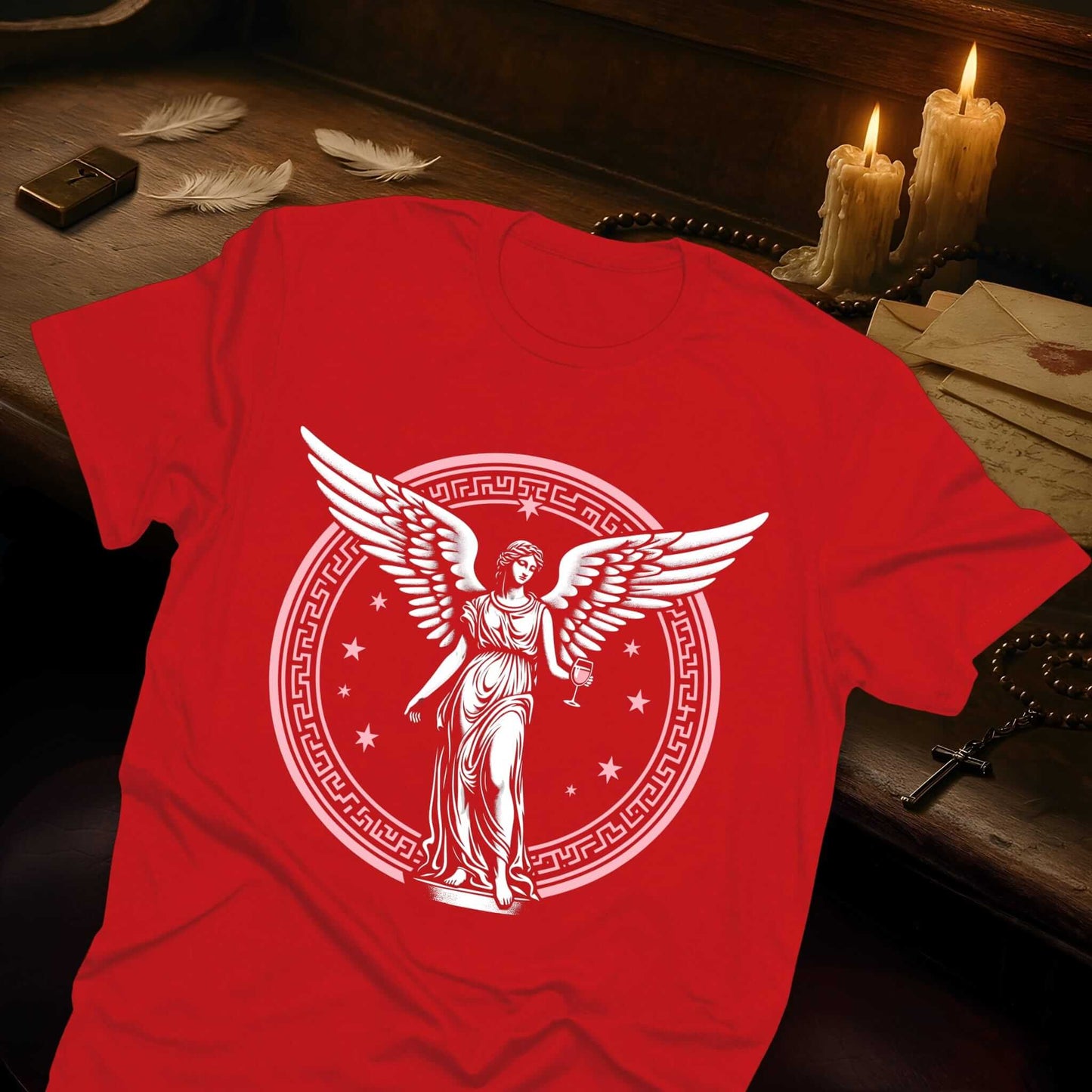Detailed angel with spread wings centered in decorative circular emblem featuring celestial stars, Heaven Can Wait collection