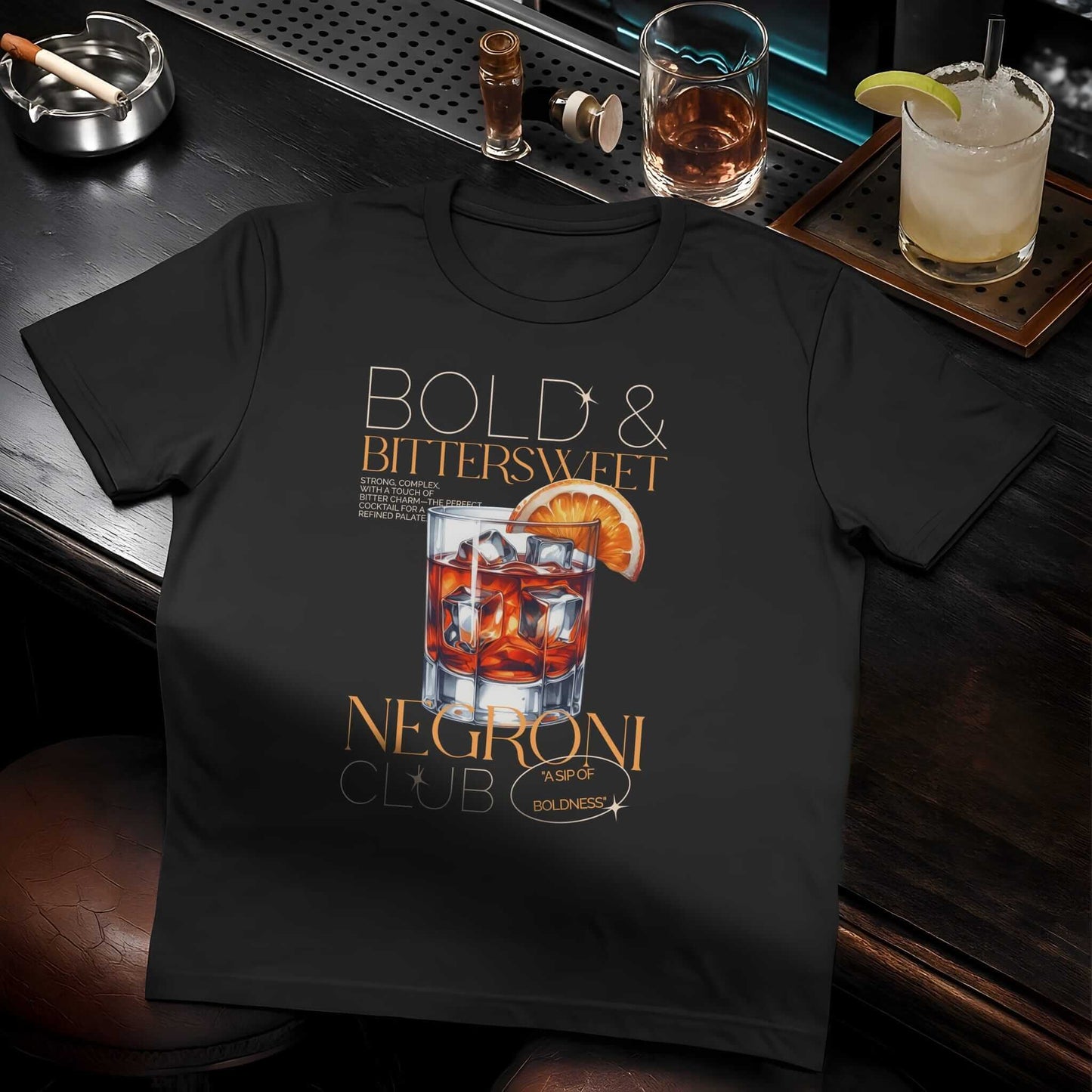 Bold & Bittersweet Negroni Club graphic tee featuring a realistic cocktail glass with ice cubes, orange slice—a party design.