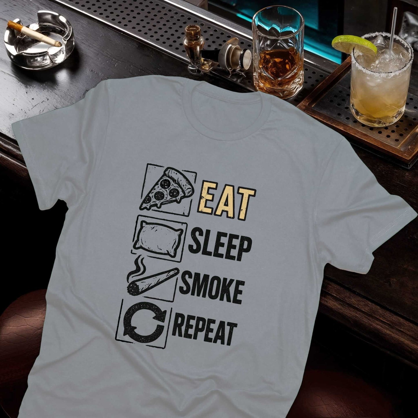 Vintage-style repeating cycle design with food, rest, tobacco, and restart symbols arranged vertically on heather gray shirt