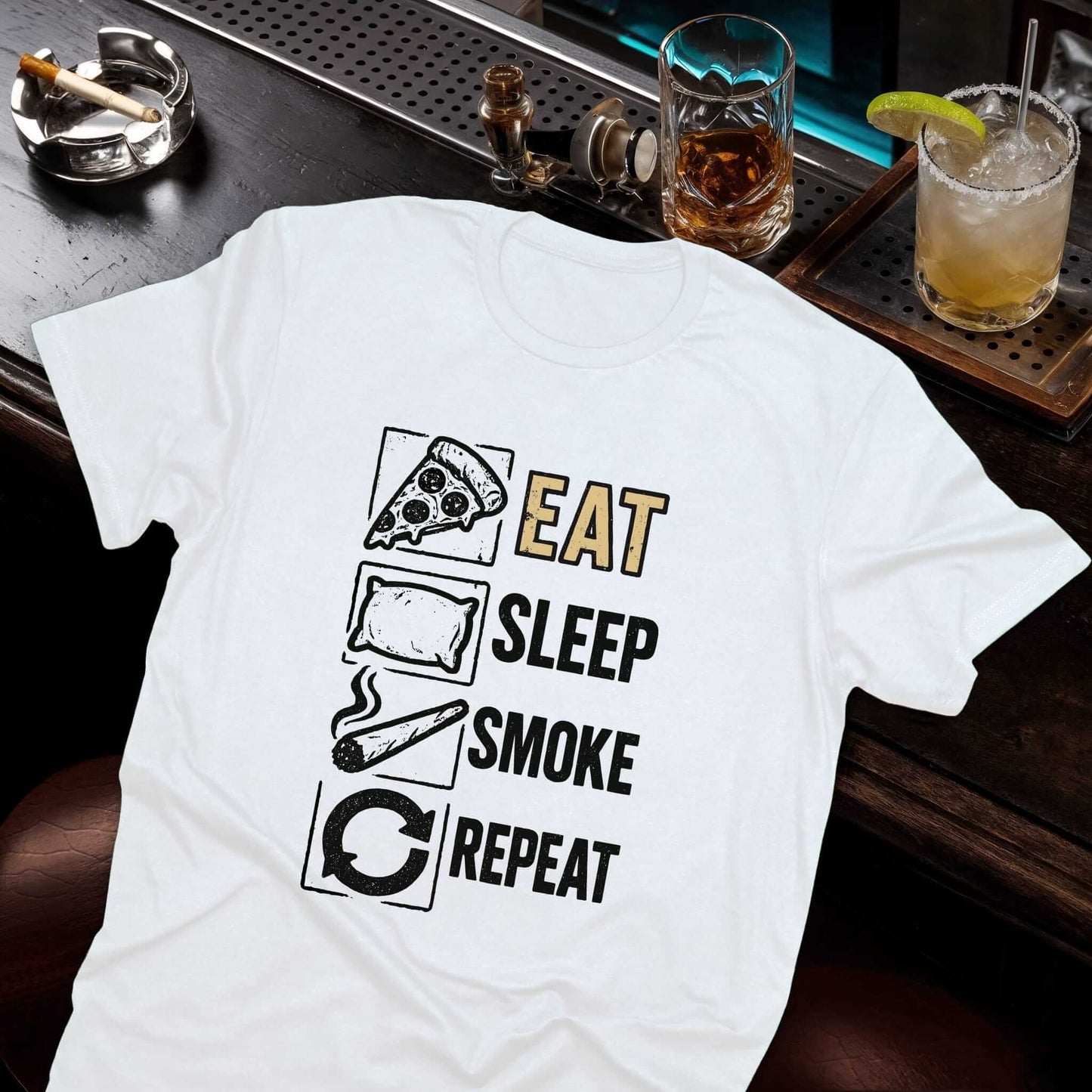 Minimalist lifestyle graphic tee featuring four daily ritual icons pizza, bed, smoking cigar, and refresh symbol in black ink