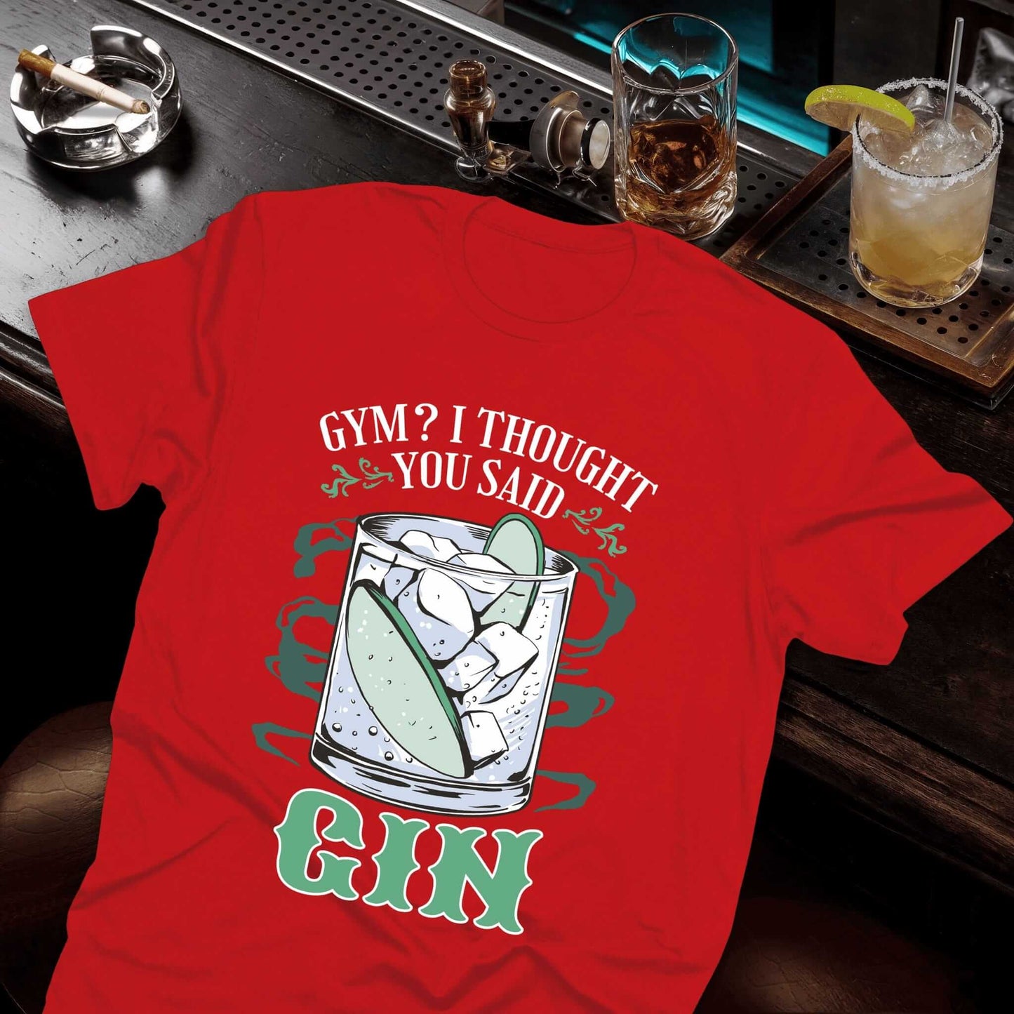 Midnight Mischief collection red t-shirt showing a detailed gin glass with lime garnish and witty gym vs gin wordplay