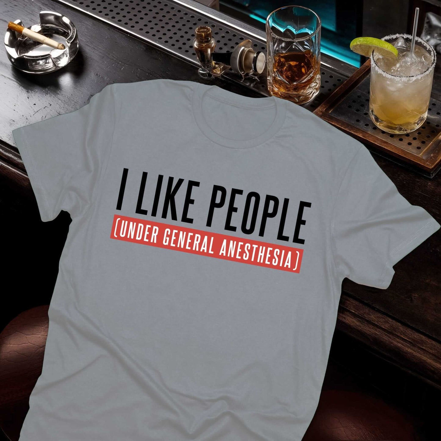 Military gray t-shirt with an amusing anesthesiologist joke, medical humor text "I LIKE PEOPLE (UNDER GENERAL ANESTHESIA)."