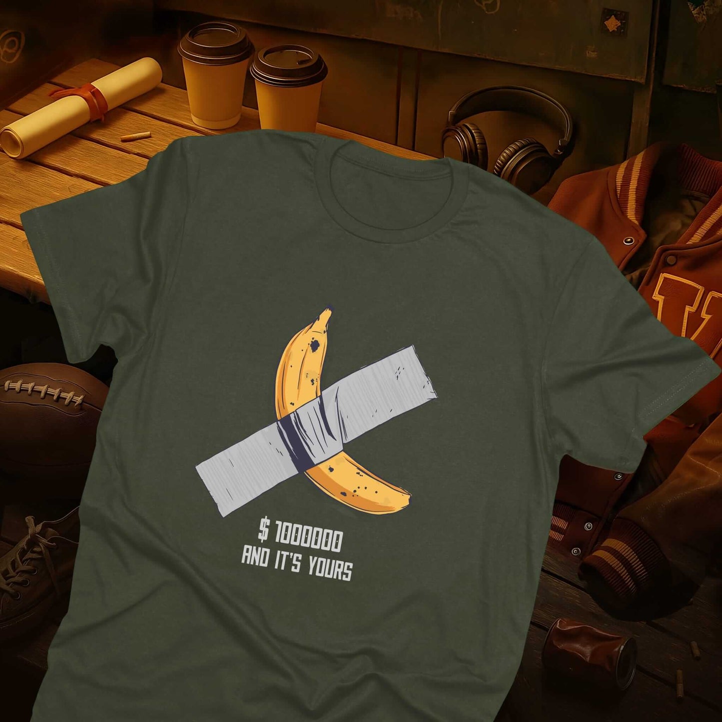 Banana affixed with tape above a sarcastic '$1000000 and it's yours' message, satirizing the costly art on the green t-shirt.