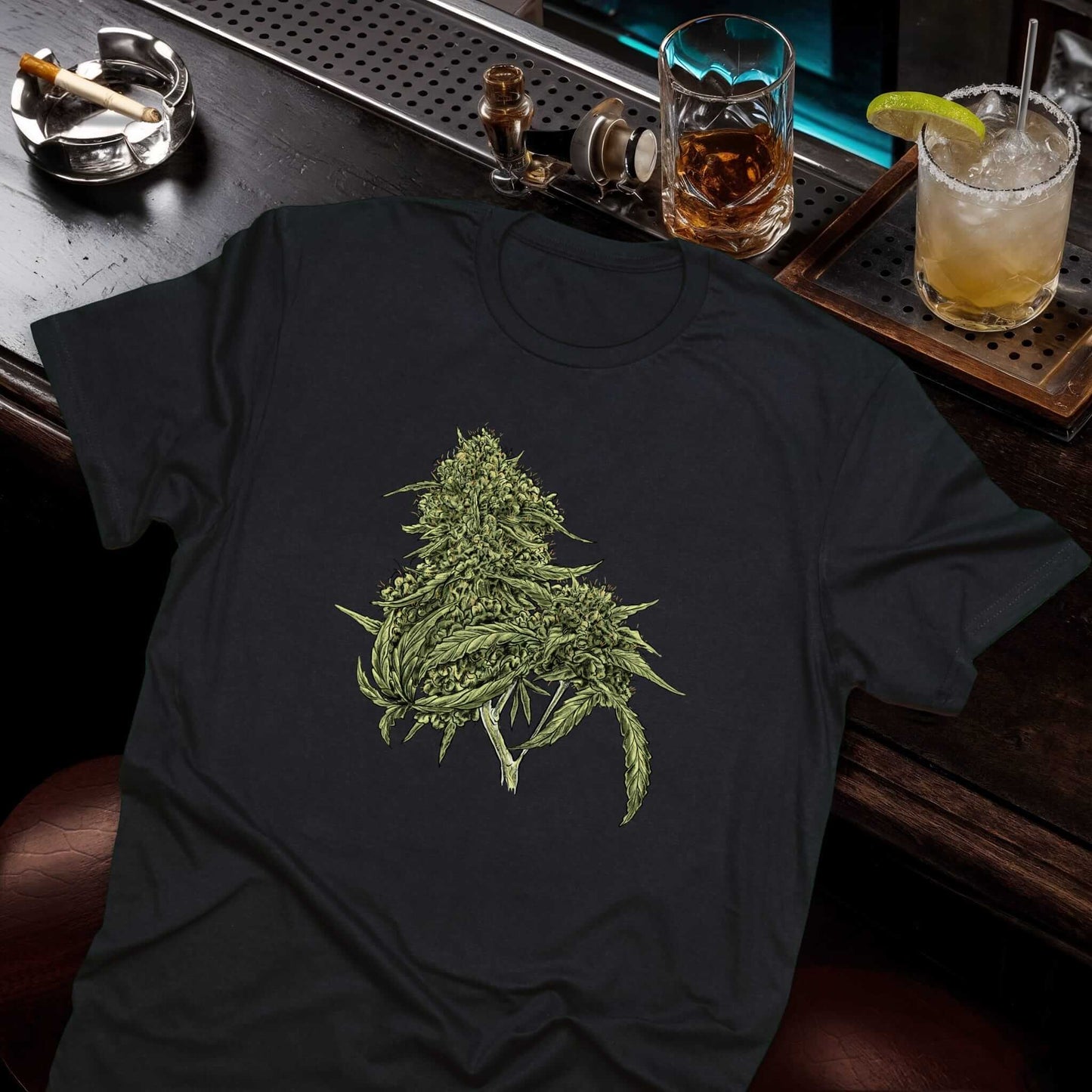 Vintage marijuana leaf artwork in green tones featuring realistic botanical details on black cotton t-shirt by Vice and Tees