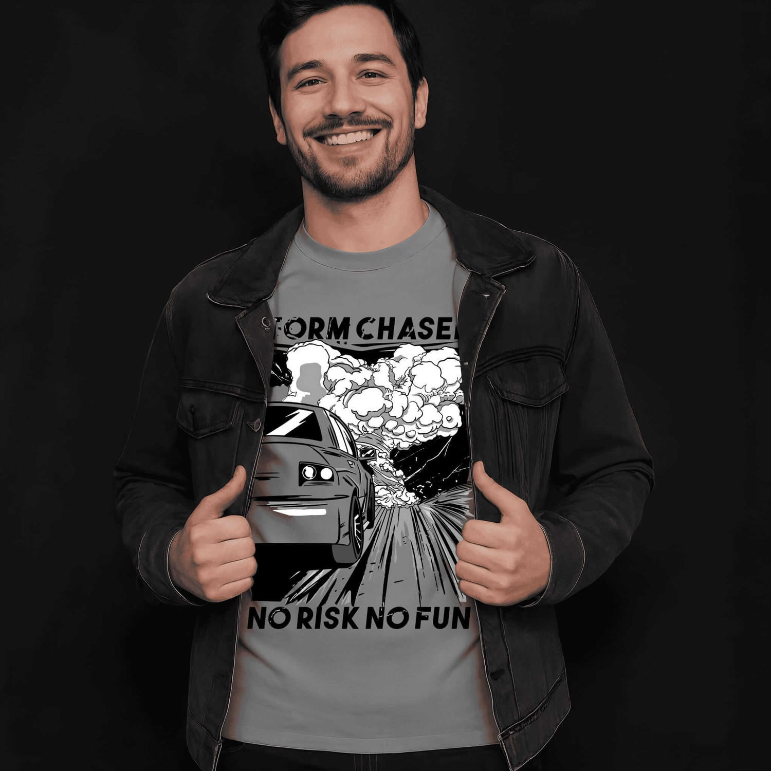 Man wearing gray Storm Chaser t-shirt with tornado graphic and "NO RISK NO FUN" quote, giving thumbs up gesture against dark background