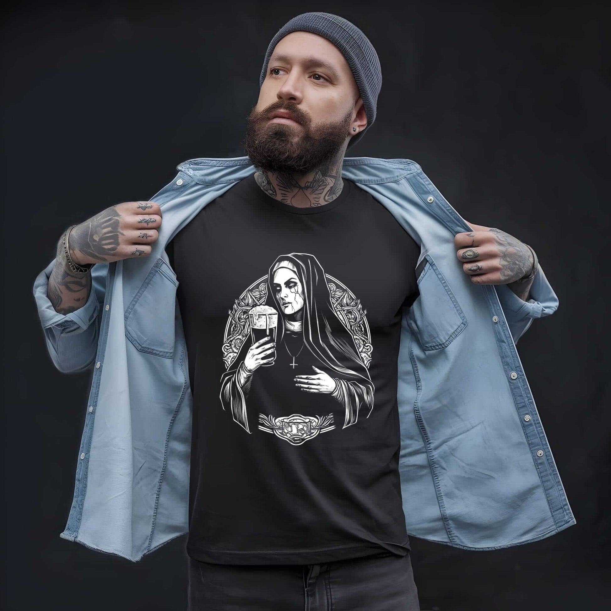 Black t-shirt with white graphic of a hooded nun figure holding a beer mug, surrounded by ornate decorative border elements.