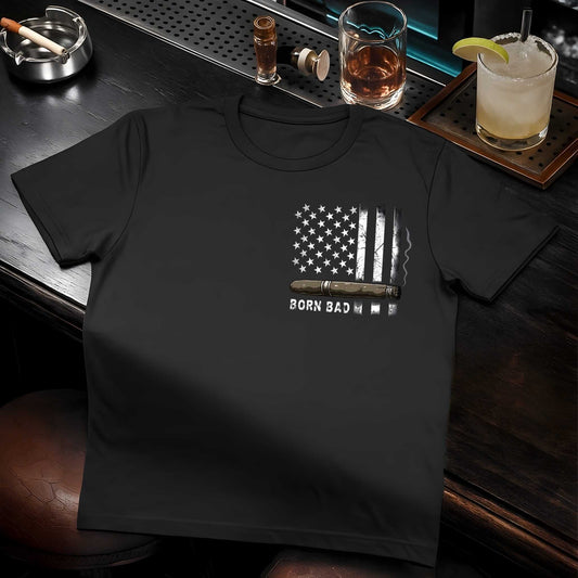 White American flag with stars and stripes graphic featuring brown cigar overlay and distressed 'BORN BAD' text below