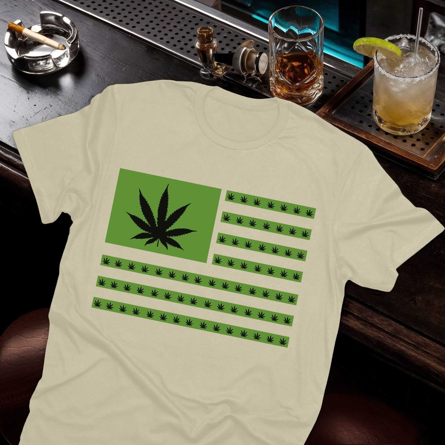 Cannabis-inspired flag graphic with marijuana leaves substituting stars and stripes on beige t-shirt