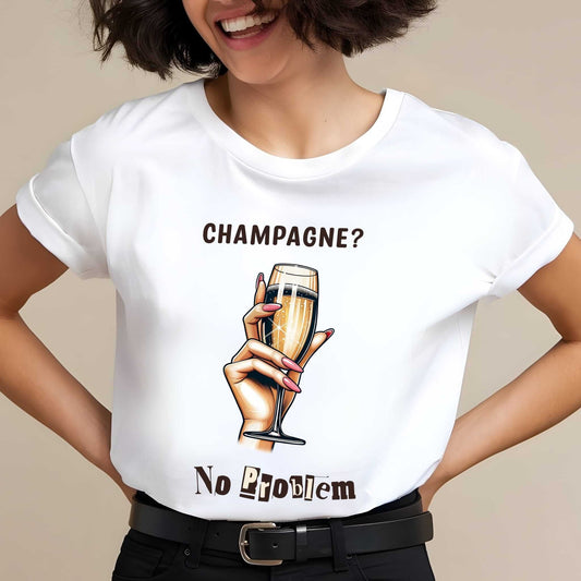 White t-shirt with 'CHAMPAGNE?' text above illustrated hand holding champagne flute, 'No Problem' below in mixed fonts