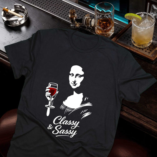 Black t-shirt with Mona Lisa holding wine glass and 'Classy & Sassy' text below in elegant script font, Vice and Tees design.