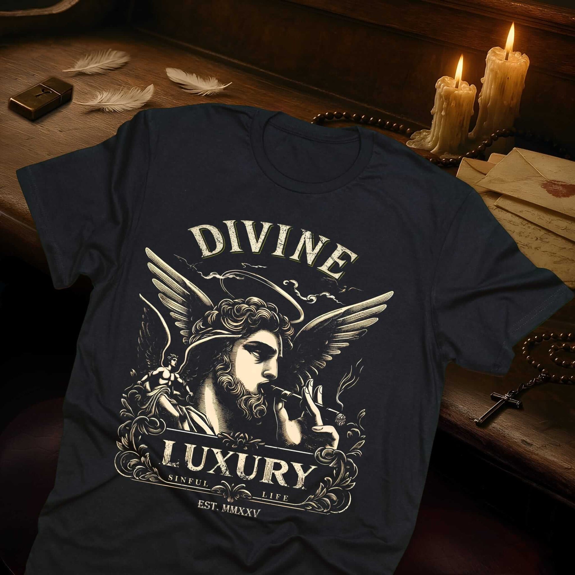 Black t-shirt with vintage-style print featuring winged angel smoking cigar, text "DIVINE LUXURY, SINFUL LIFE - EST. MMXXV"