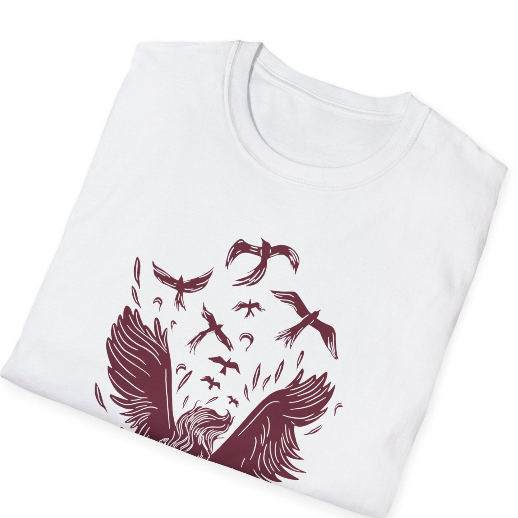 Eye-catching angel graphic with ornate wings, flowing elements, and detailed burgundy illustration on white folded t-shirt