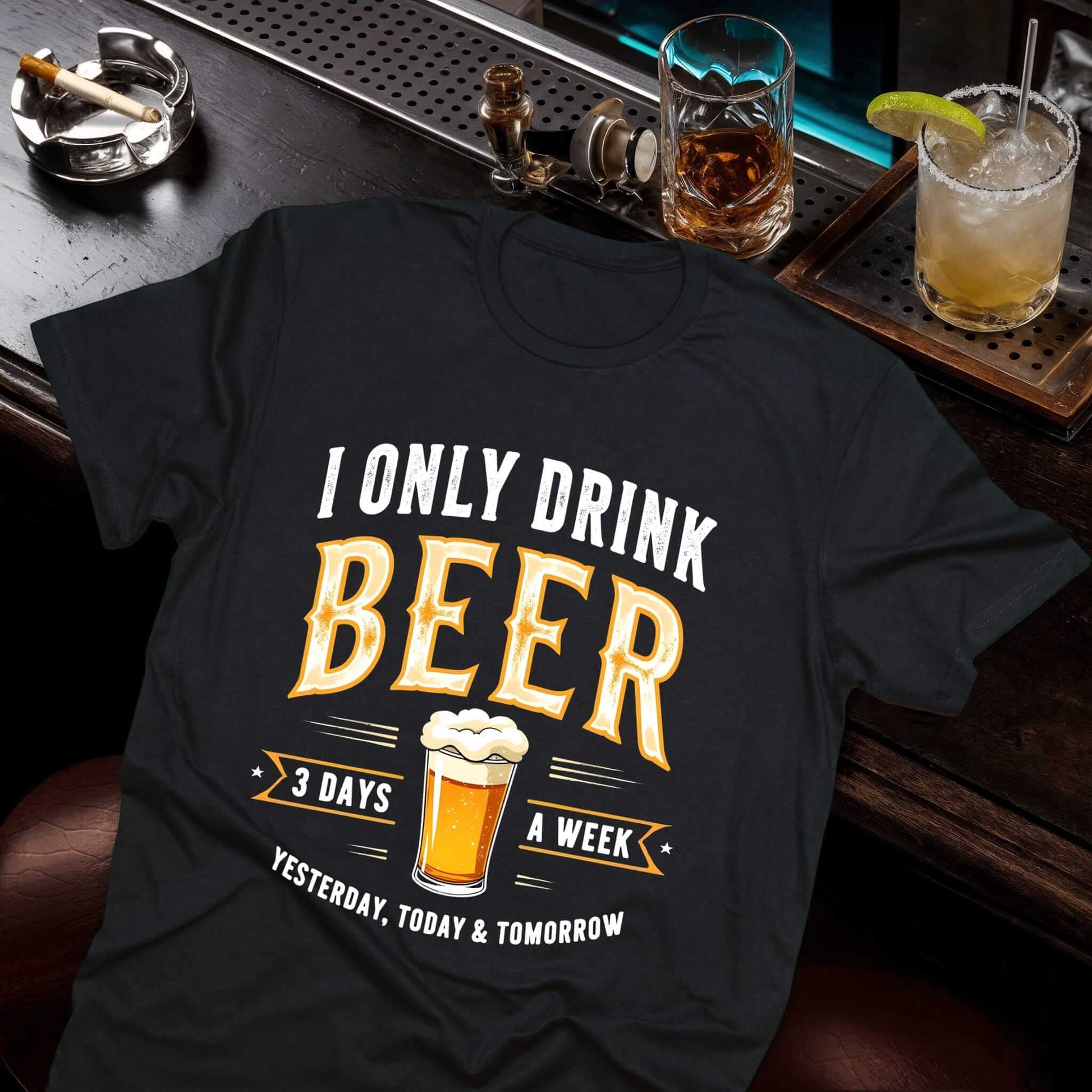 Black t-shirt with I ONLY DRINK BEER 3 DAYS A WEEK YESTERDAY TODAY TOMORROW text and frothy beer mug graphic in vintage style