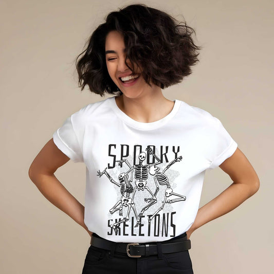 Funny dancing skeletons graphic with 'SPOOKY SKELETONS' text in black ink on white cotton tee, Vice and Tees design.