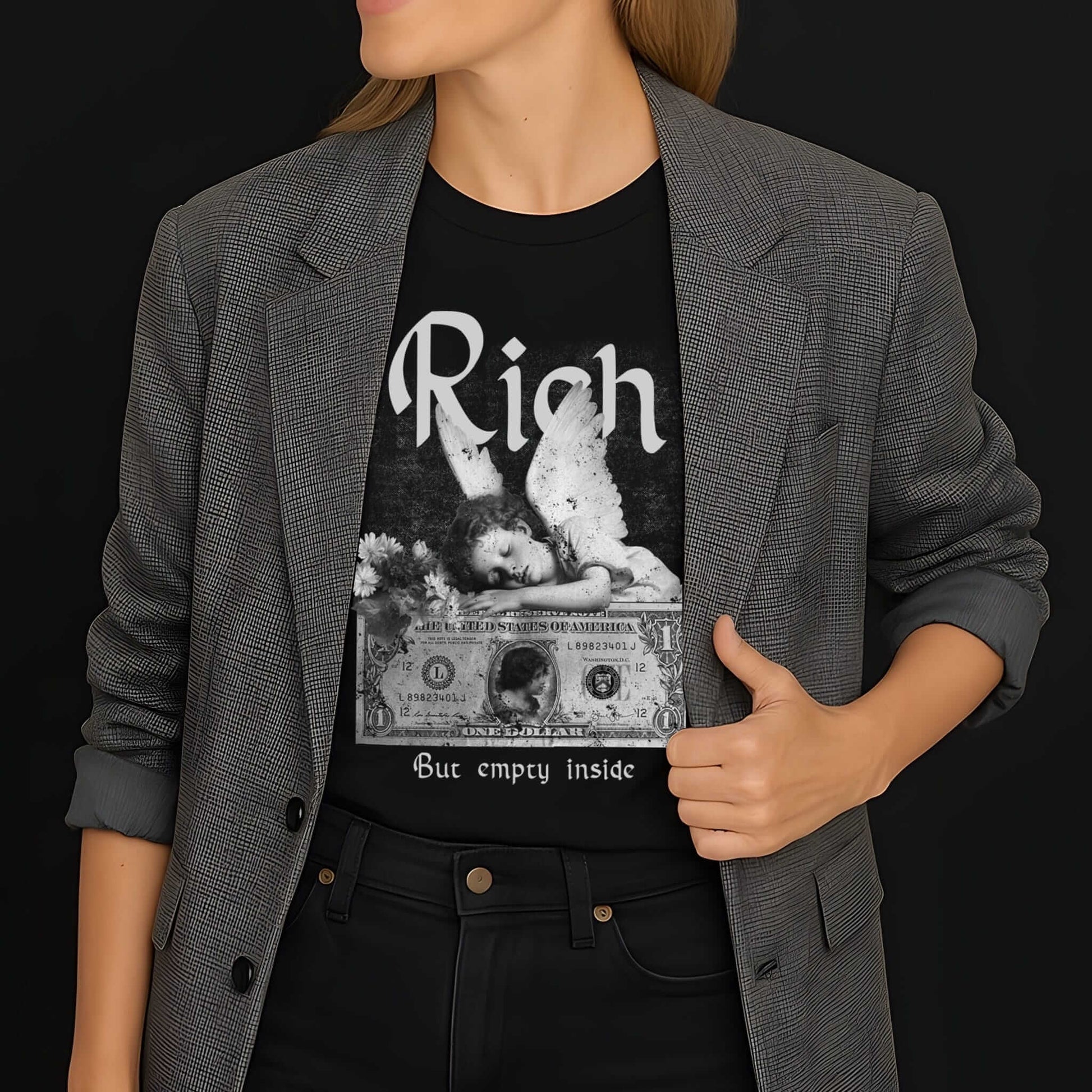 Black t-shirt with vintage Rich text, winged angel illustration, dollar bill graphic, "But empty inside" in distressed white.