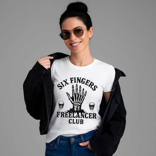 Woman wearing white tee with "SIX FINGERS FREELANCER CLUB" text, skeletal hand graphic, and skull designs in black ink.
