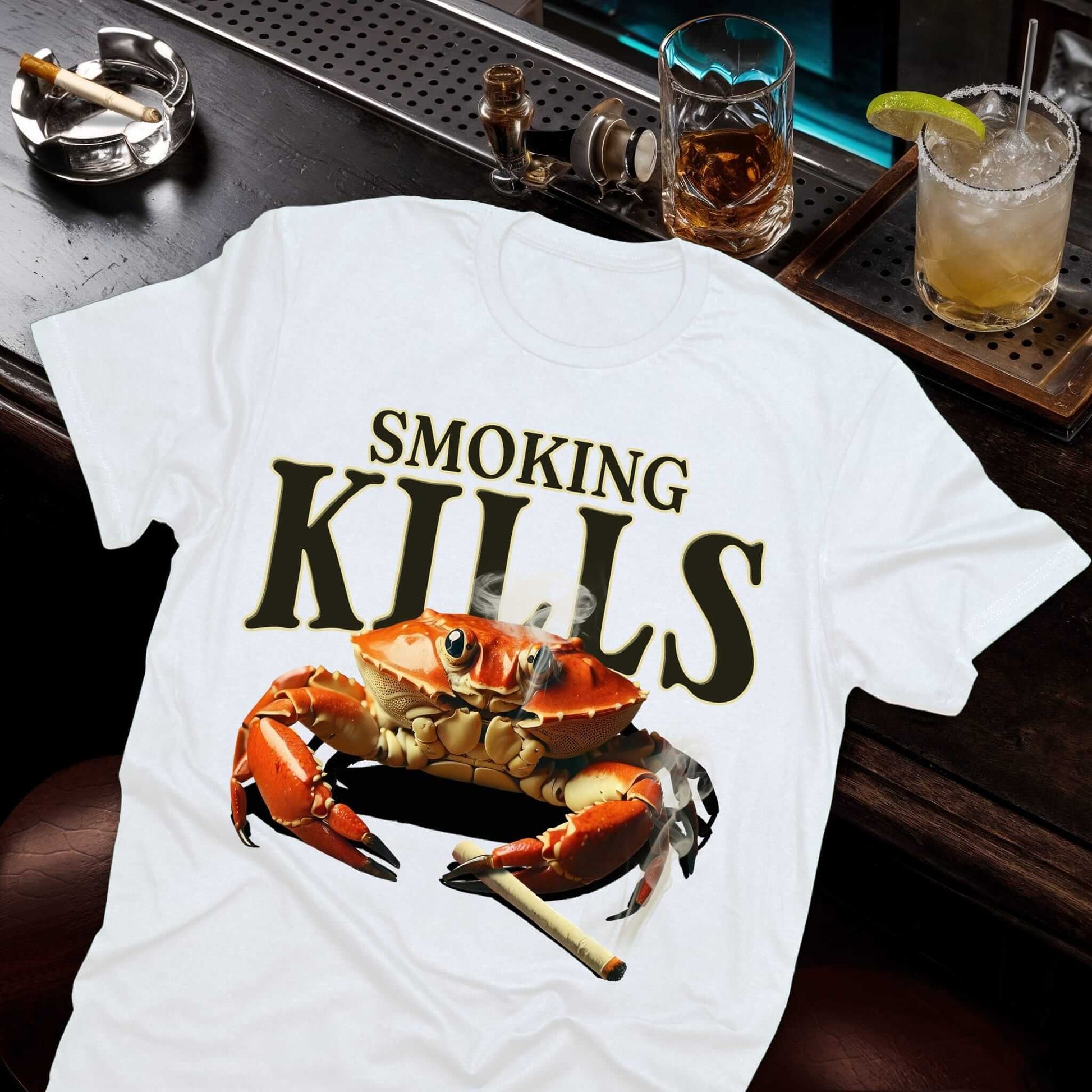 Detailed orange-red crab gripping lit cigarette beneath SMOKING KILLS typography in olive green font on cotton white t-shirt