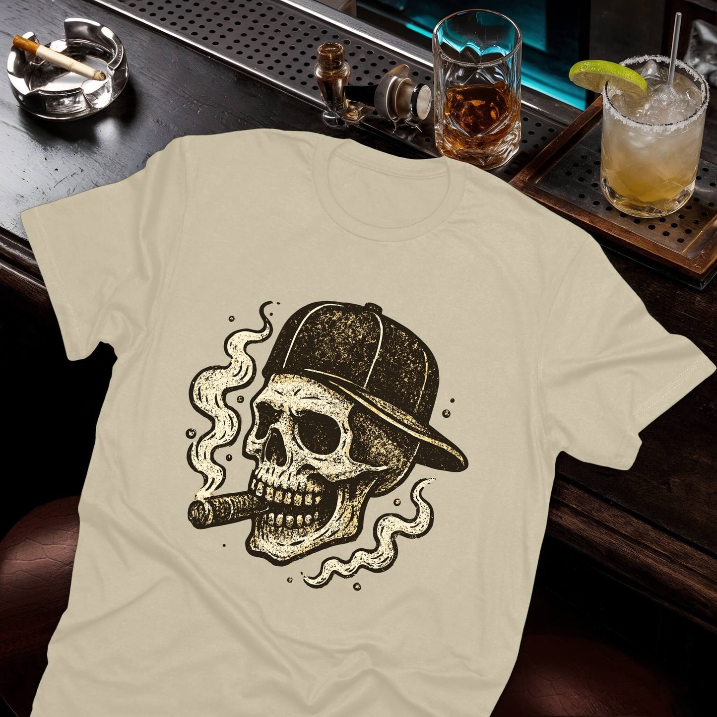 Grunge skull graphic with backward cap and cigar, decorated with flowing smoke tendrils in aged illustration style, beige tee